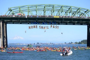 Kayaks across the Columbia river yesterday: a symbolic flotilla against proposed fossil fuel exports that would mean game over for our climate